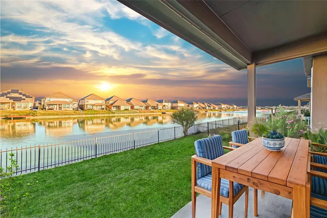 a patio with table and chairs