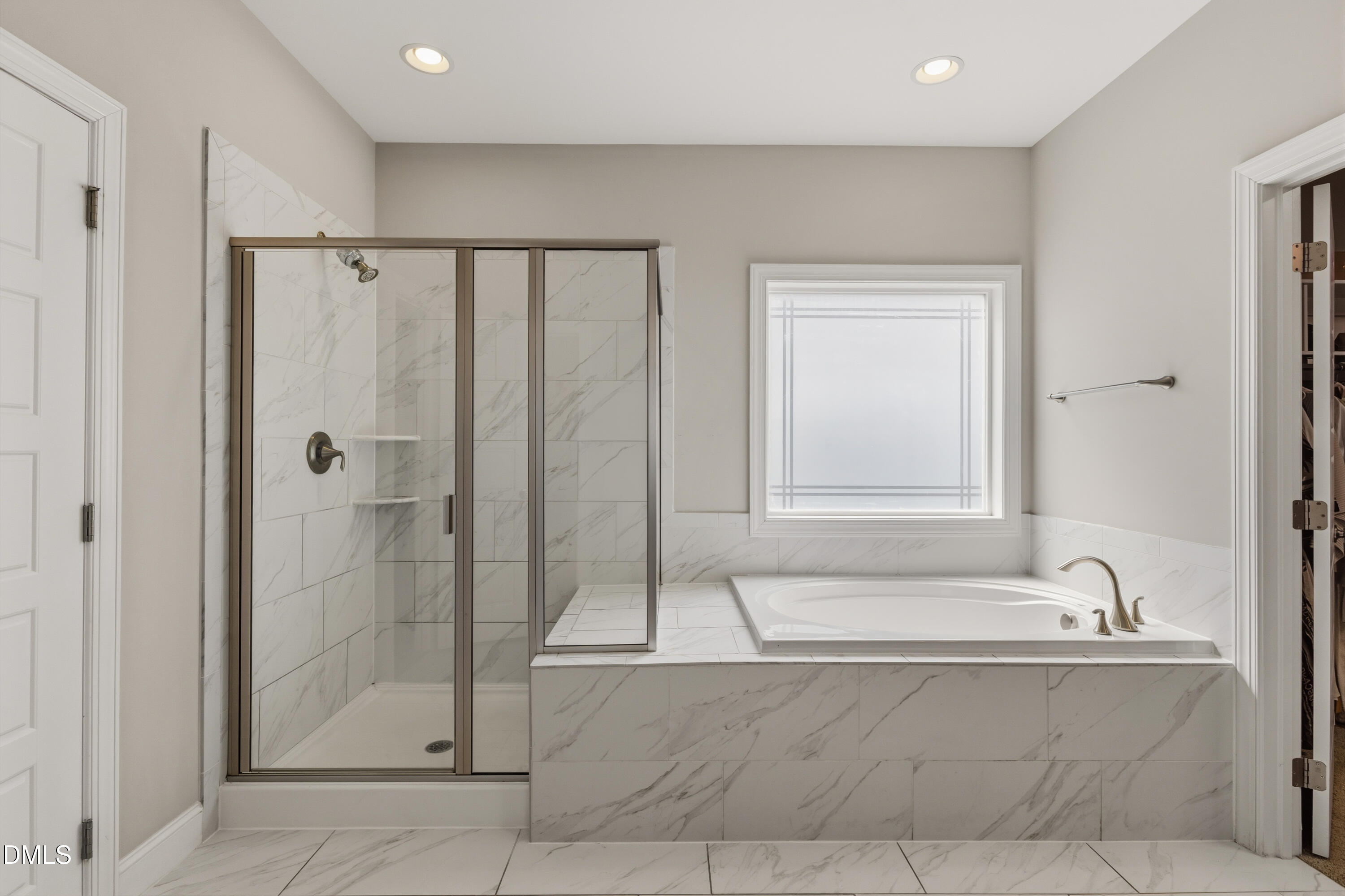 7421 Stonehenge Farm Lane Raleigh, NC 27613 - Photo 11 of 48 a bathroom with a bathtub and a shower