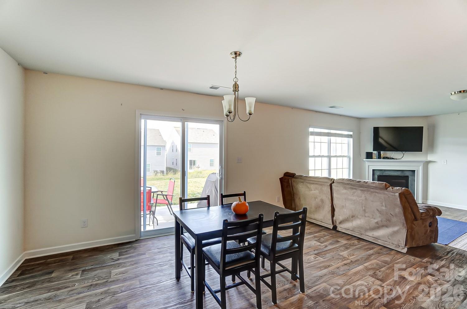 618 Bloomover Street Concord, NC 28025 - Photo 17 of 45 a view of a dining room with furniture window and wooden floor