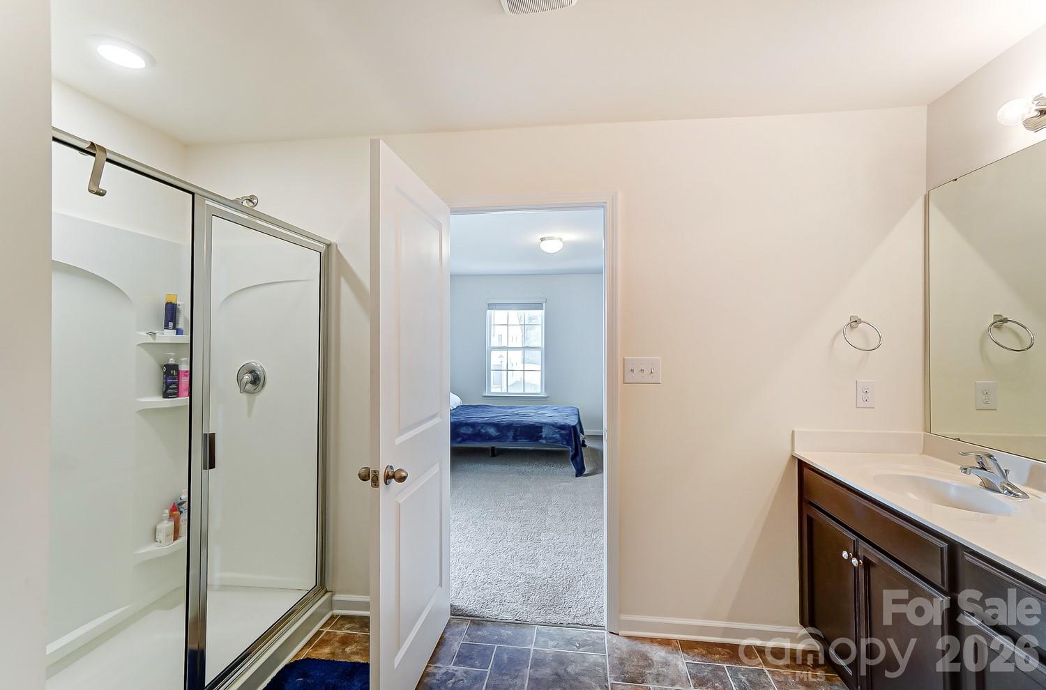 618 Bloomover Street Concord, NC 28025 - Photo 28 of 45 a bathroom with a shower sink and mirror