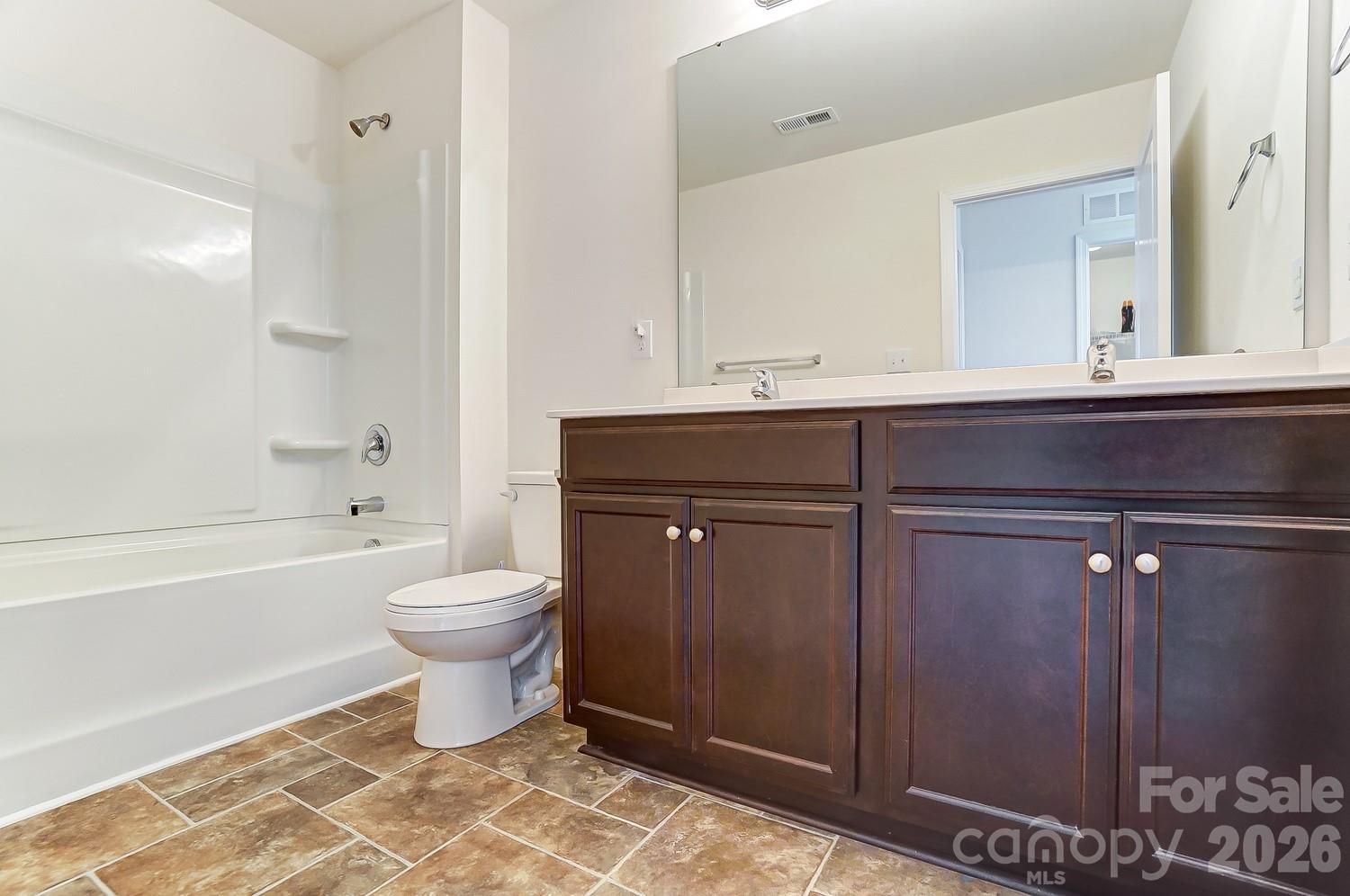 618 Bloomover Street Concord, NC 28025 - Photo 31 of 45 a bathroom with a sink toilet a mirror and bathtub