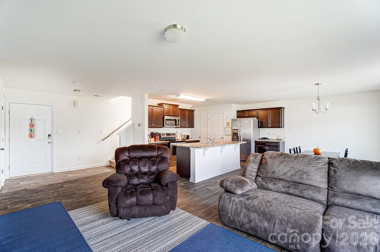 618 Bloomover Street Concord, NC 28025 - Photo 8 of 45 a living room with furniture and a wooden floor