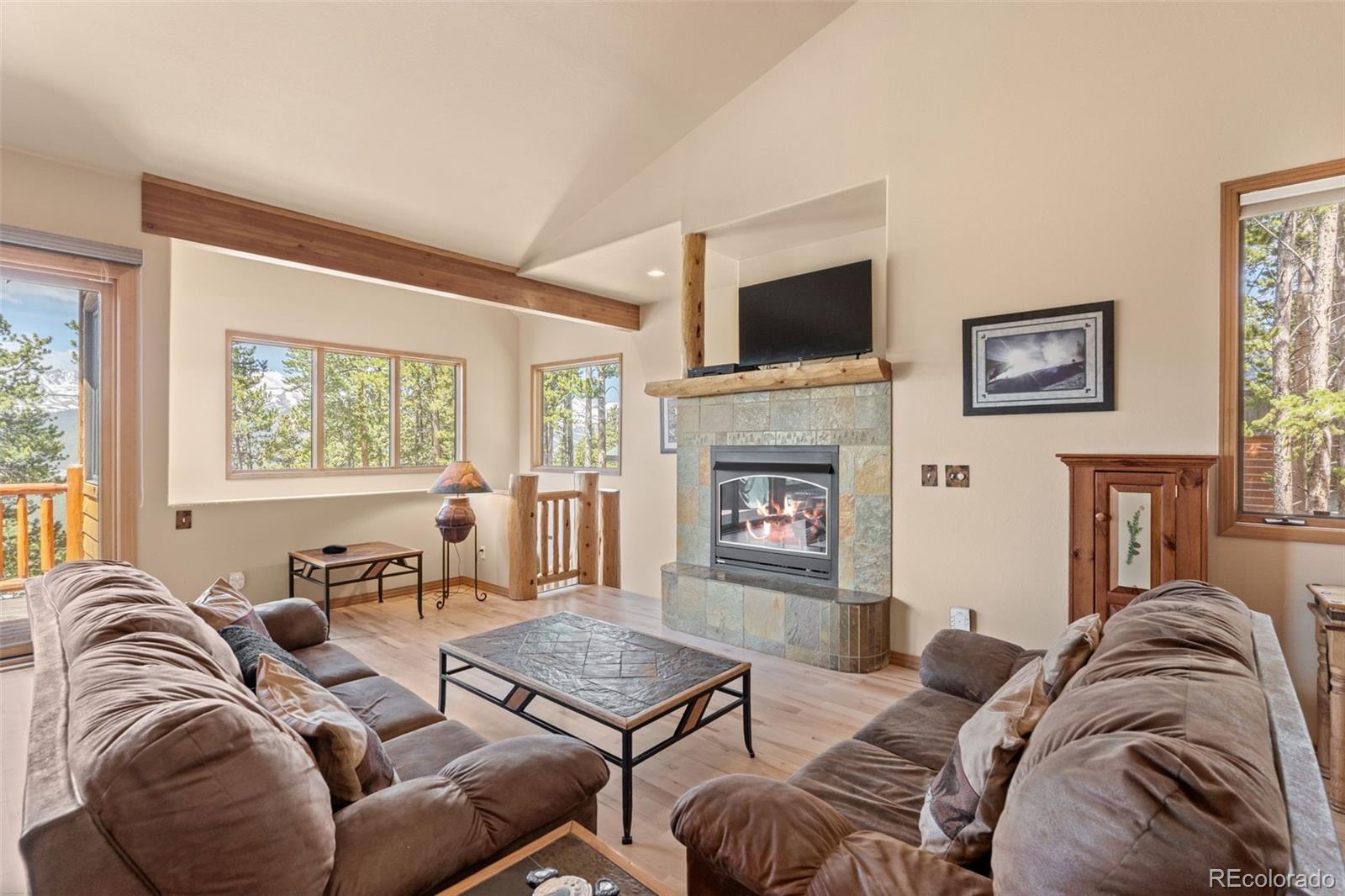 92 Emmett Lode Road, Unit B Breckenridge, CO 80424 - Photo 10 of 50 a living room with furniture or flat screen tv and a fireplace