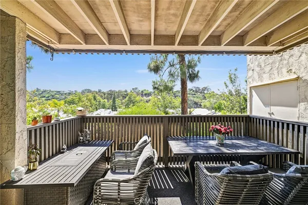 a view of balcony with wooden floor