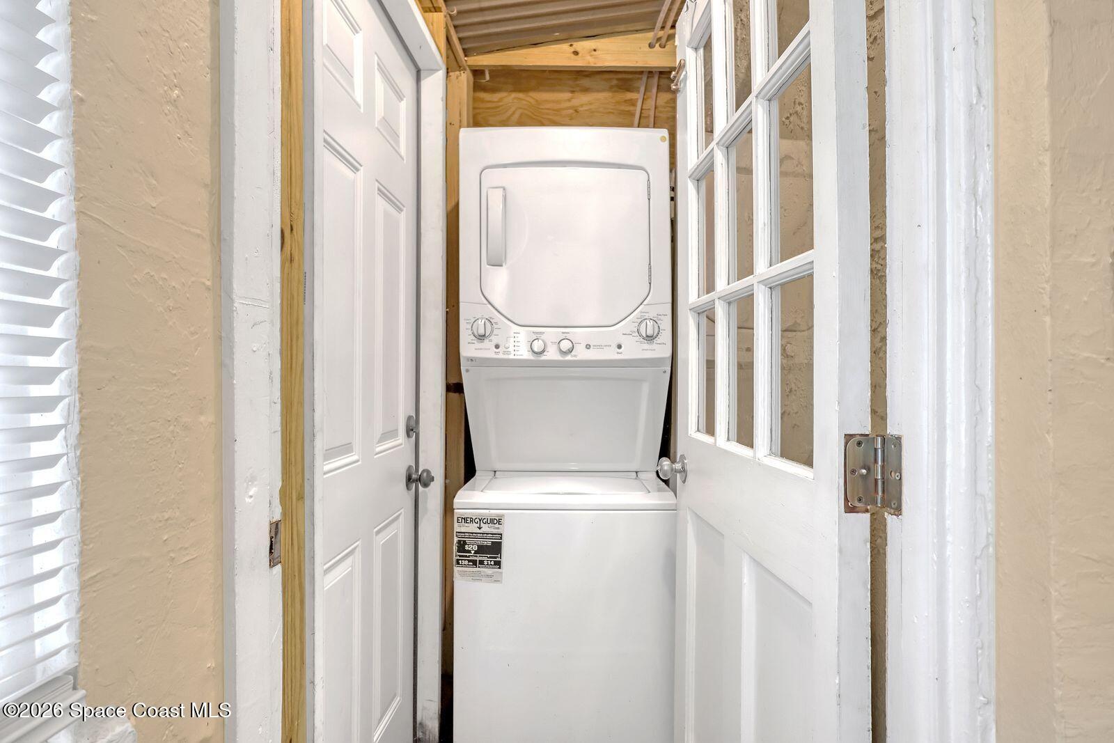 658 Young Street Melbourne, FL 32935 - Photo 32 of 77 a utility room with a window and a white door