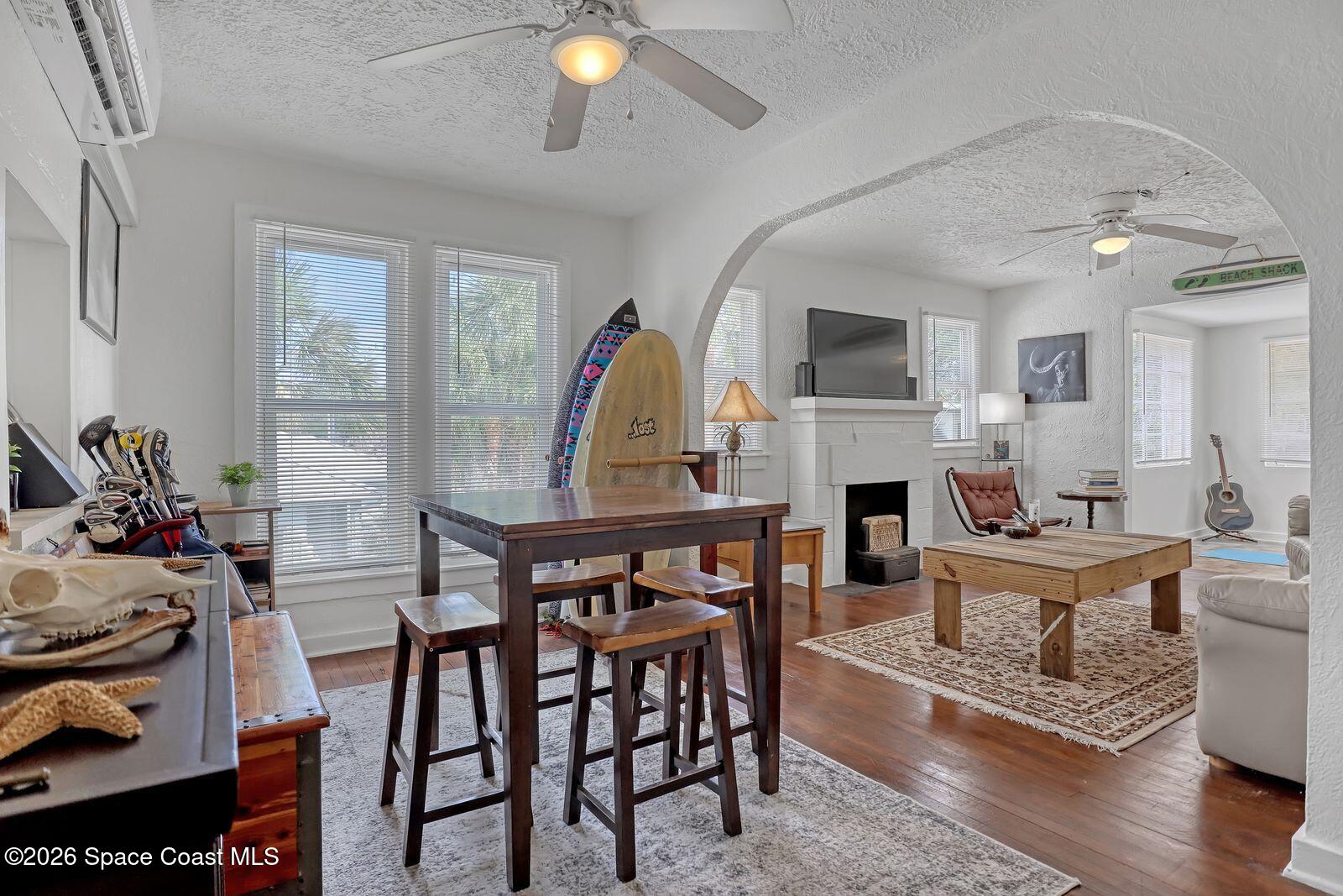 658 Young Street Melbourne, FL 32935 - Photo 37 of 77 a living room with furniture a fireplace and a flat screen tv
