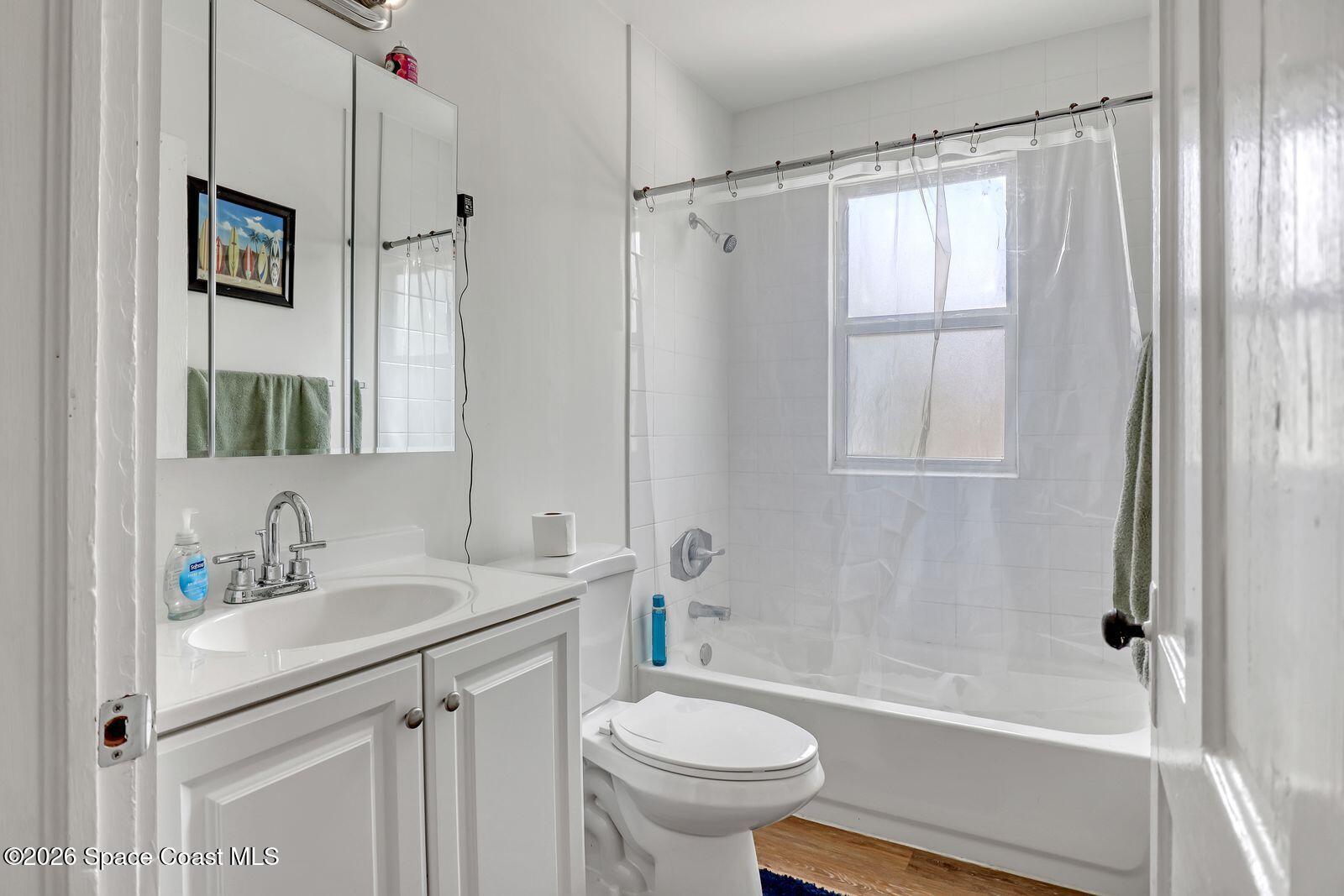 658 Young Street Melbourne, FL 32935 - Photo 52 of 77 a bathroom with a sink toilet and shower