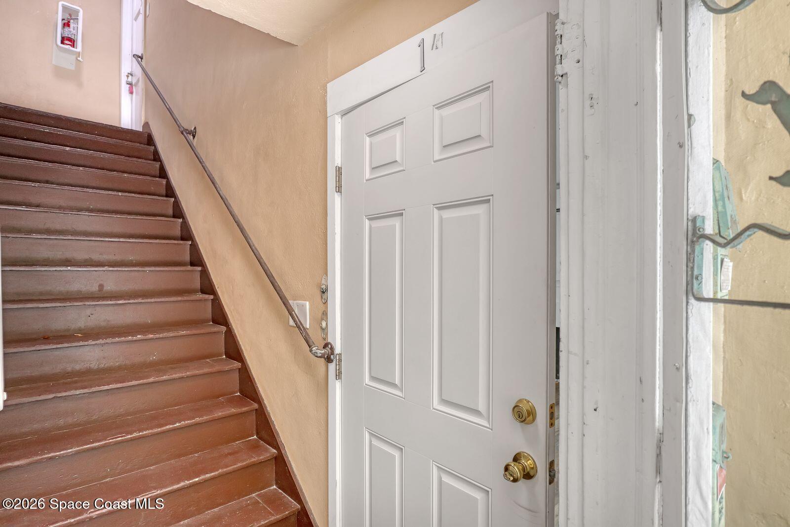 658 Young Street Melbourne, FL 32935 - Photo 6 of 77 a view of a hallway with wooden floor and entryway