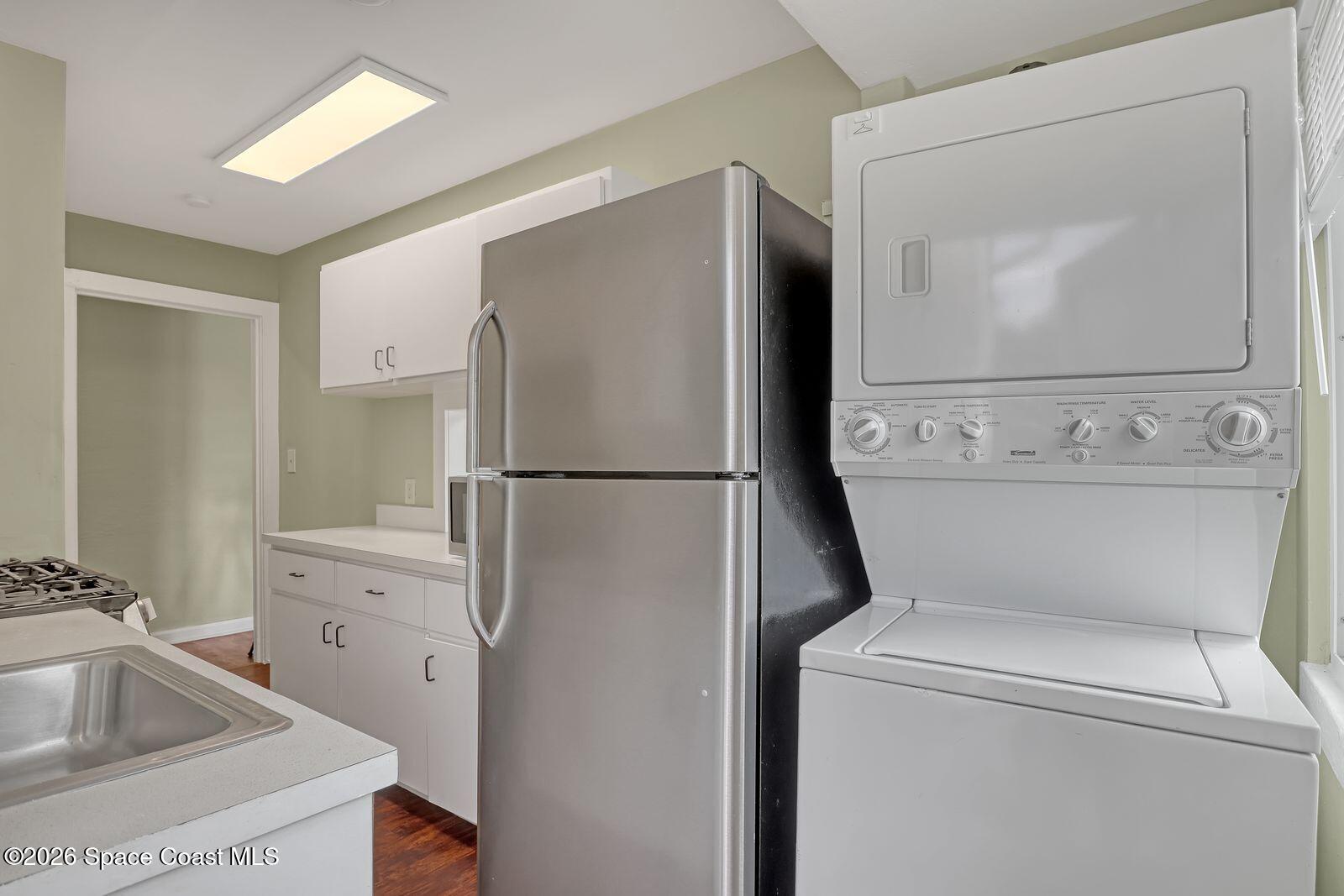658 Young Street Melbourne, FL 32935 - Photo 63 of 77 a bathroom with a toilet sink and mirror