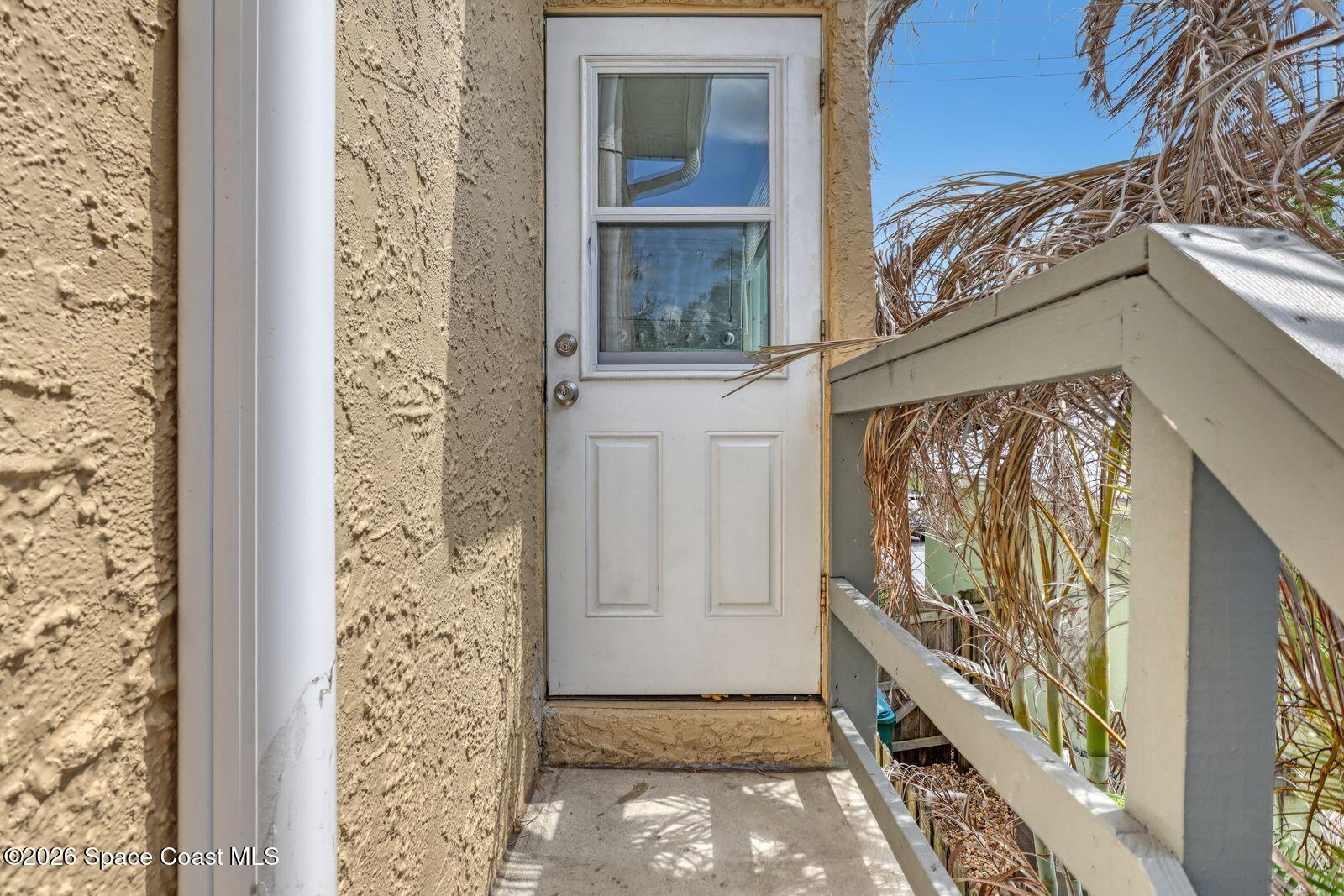 658 Young Street Melbourne, FL 32935 - Photo 67 of 77 a view of a door and wooden floor