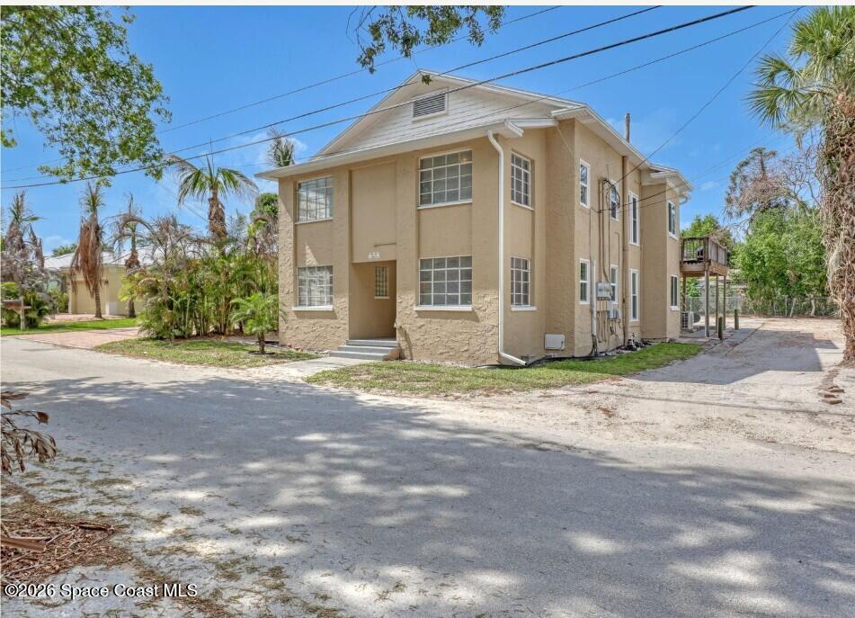 658 Young Street Melbourne, FL 32935 - Photo 73 of 77 a front view of a house with a yard