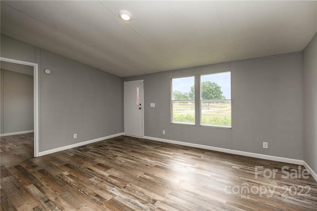 3808 Belk Mill Road Wingate, NC 28174 - Photo 4 of 18 en empty room with windows