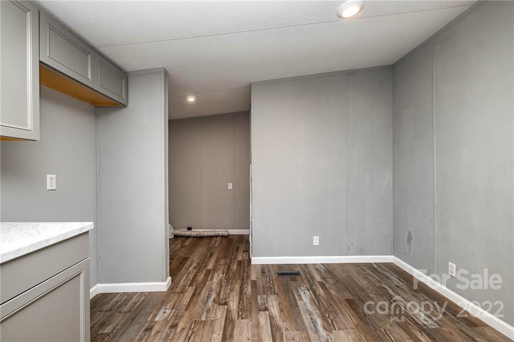 3808 Belk Mill Road Wingate, NC 28174 - Photo 5 of 18 a view of bedroom with a bed and wooden floor