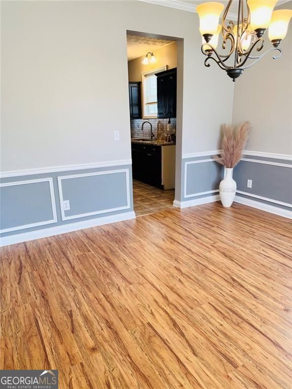 543 Saddle Ridge Drive Bethlehem, GA 30620 - Photo 10 of 36 a view of empty room with wooden floor