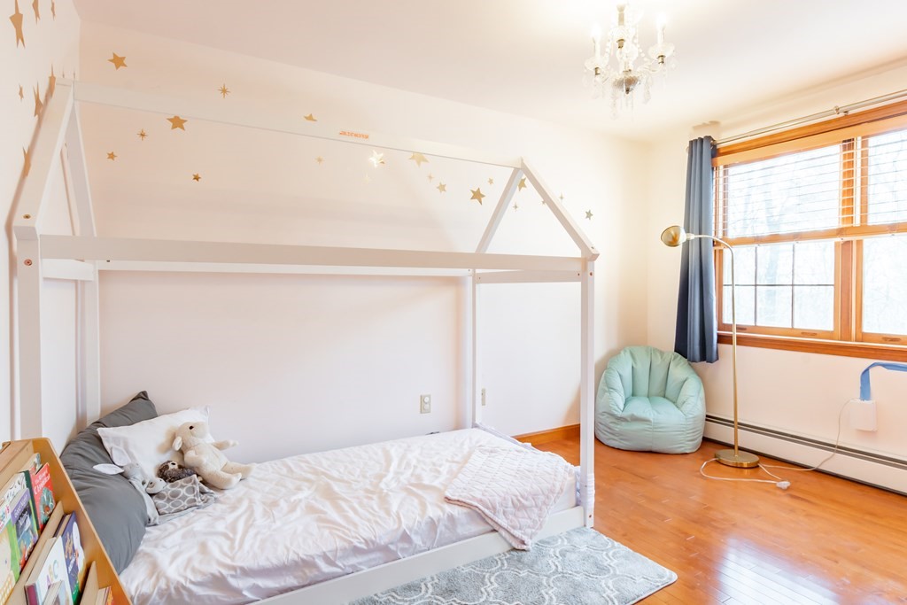 38 Westview Road Brookline, NH 03033 - Photo 15 of 28 a bedroom with a bed and a window