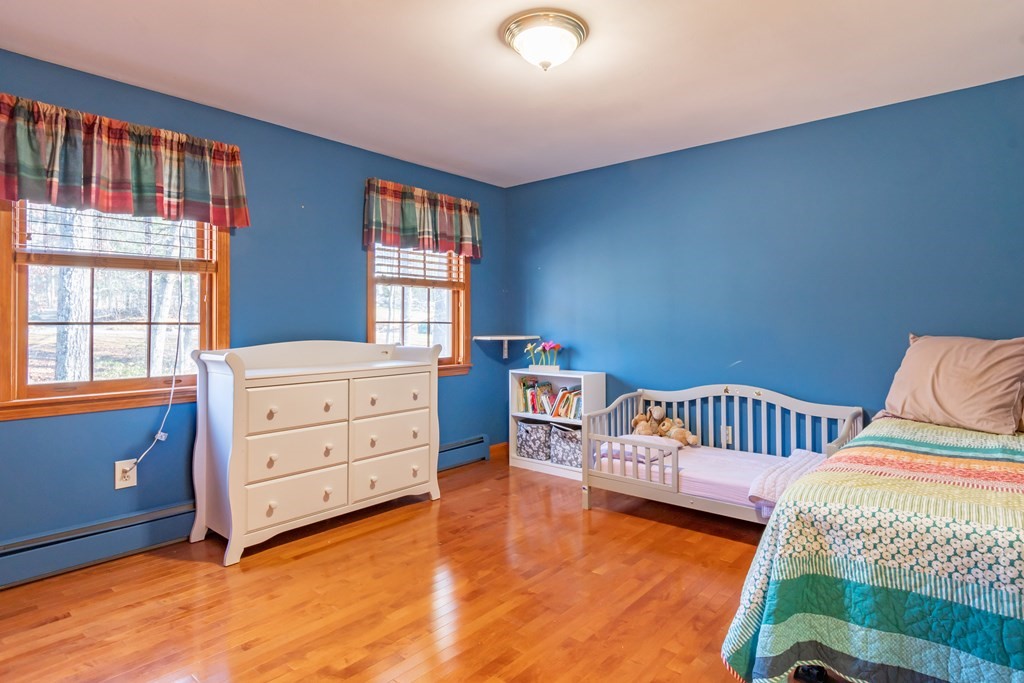 38 Westview Road Brookline, NH 03033 - Photo 17 of 28 a bedroom with a bed and a window