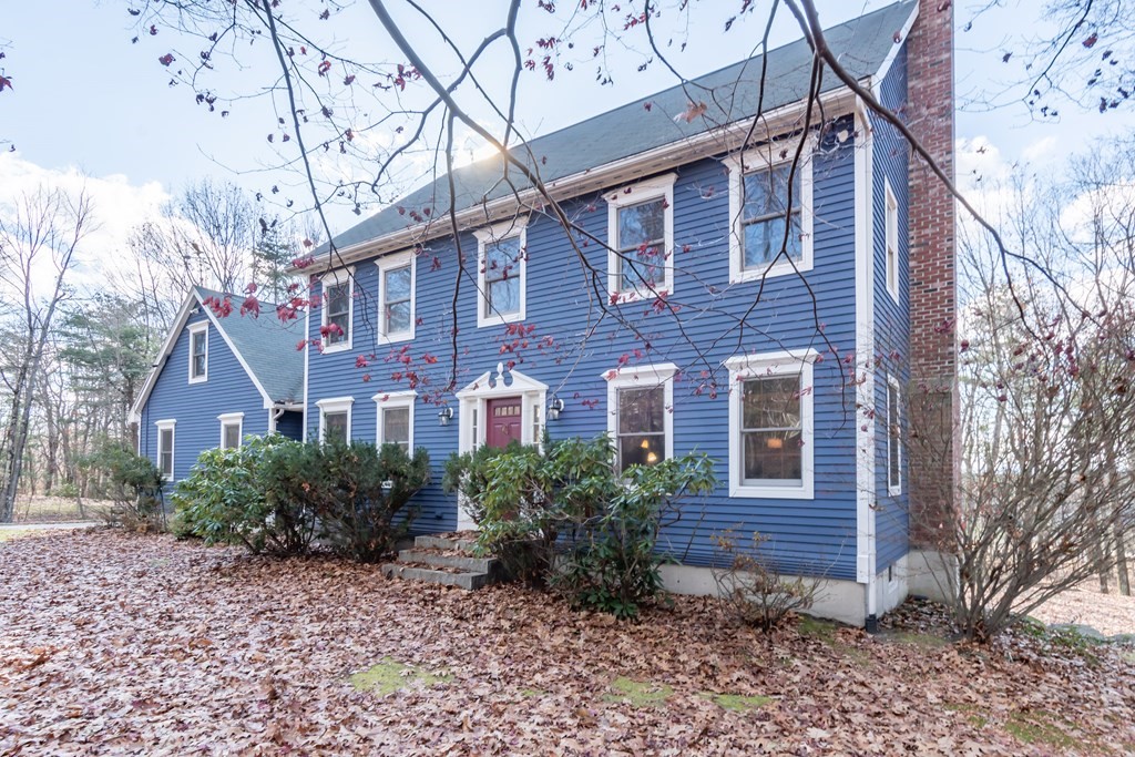 38 Westview Road Brookline, NH 03033 - Photo 2 of 28 a front view of a house with garden
