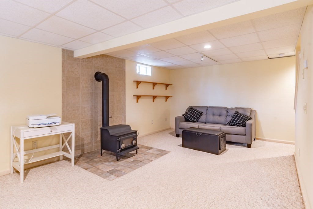 38 Westview Road Brookline, NH 03033 - Photo 22 of 28 a living room with furniture and a window