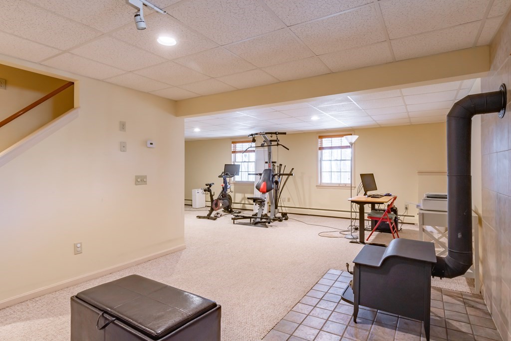 38 Westview Road Brookline, NH 03033 - Photo 23 of 28 a living room with furniture and a flat screen tv