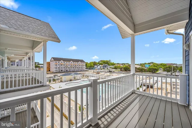 a view of a balcony with a chairs