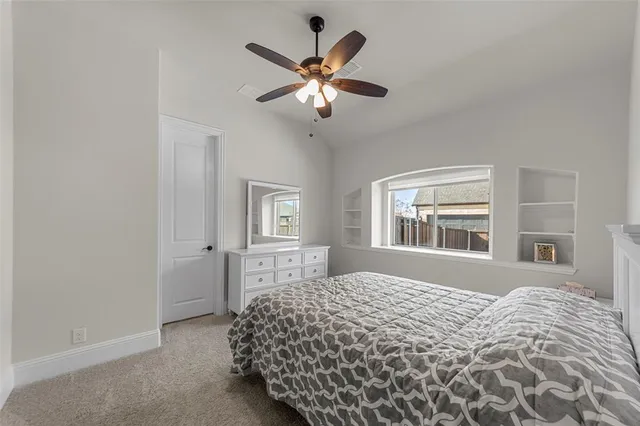 a room with a wooden floor and white walls