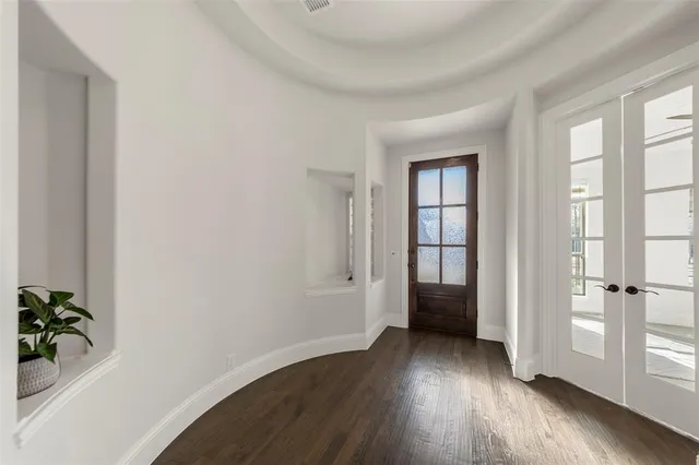 a view of entryway with wooden floor and stairs