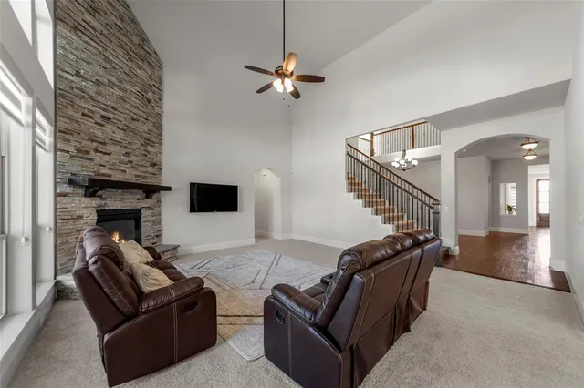 a kitchen with stainless steel appliances a sink a stove a refrigerator and cabinets
