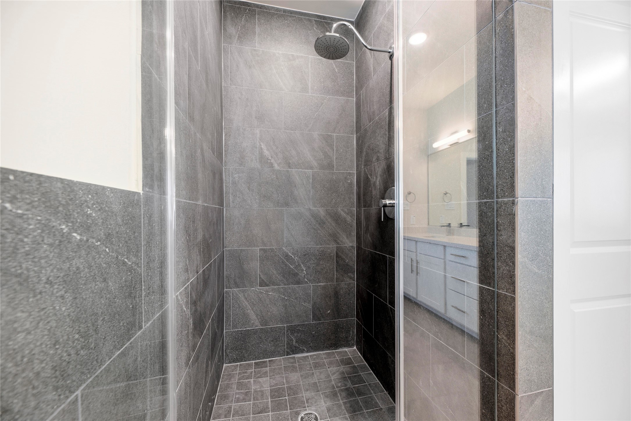 3075 Hicks Street Houston, TX 77007 - Photo 24 of 34 a bathroom with a glass shower door
