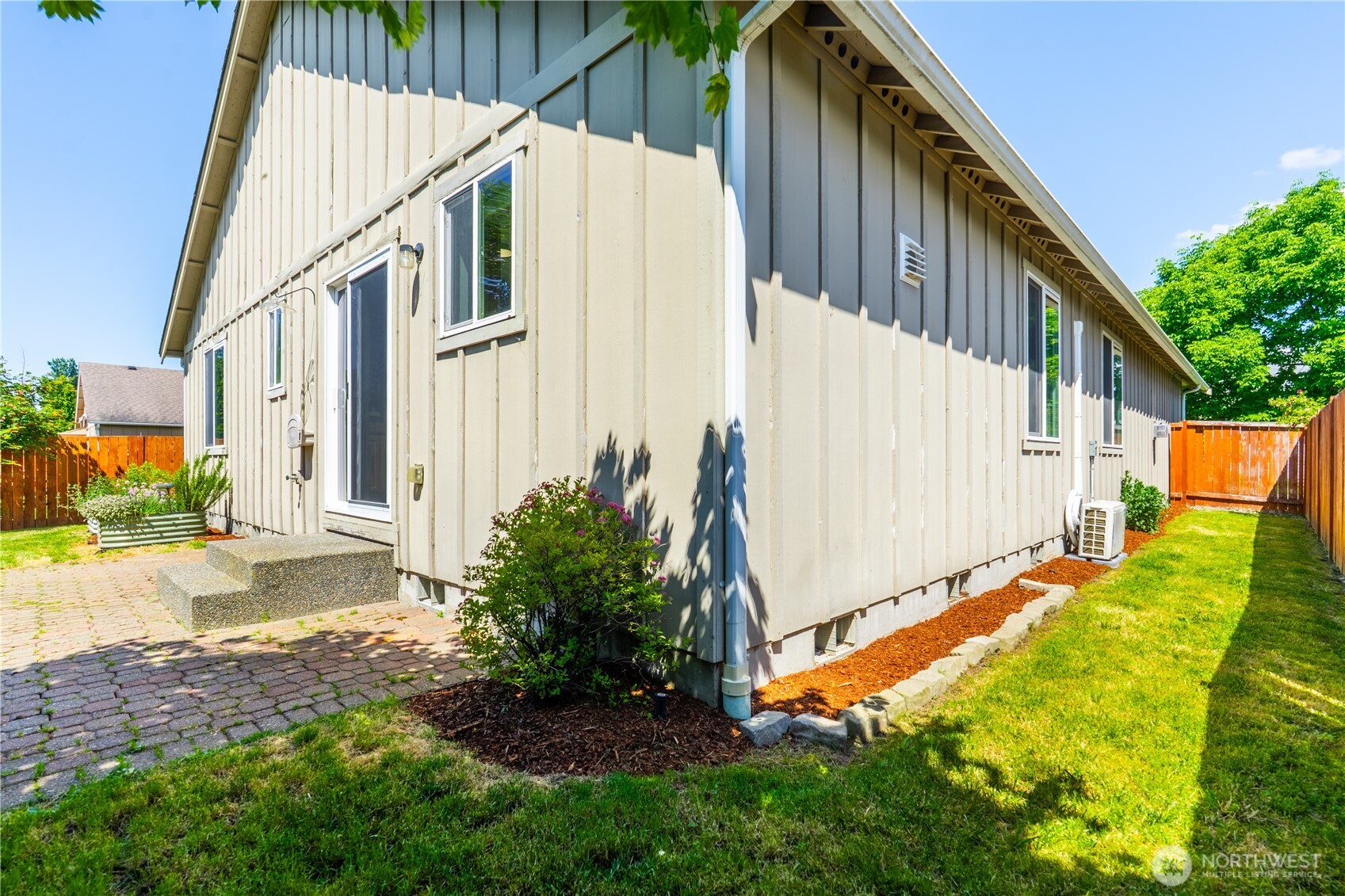242 Riggs Drive East Enumclaw, WA 98022 - Photo 31 of 40 a view of an house with backyard and garden