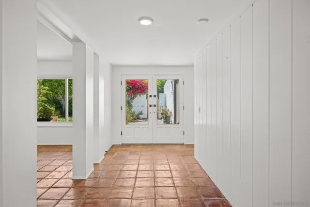 a view of a hallway with front door