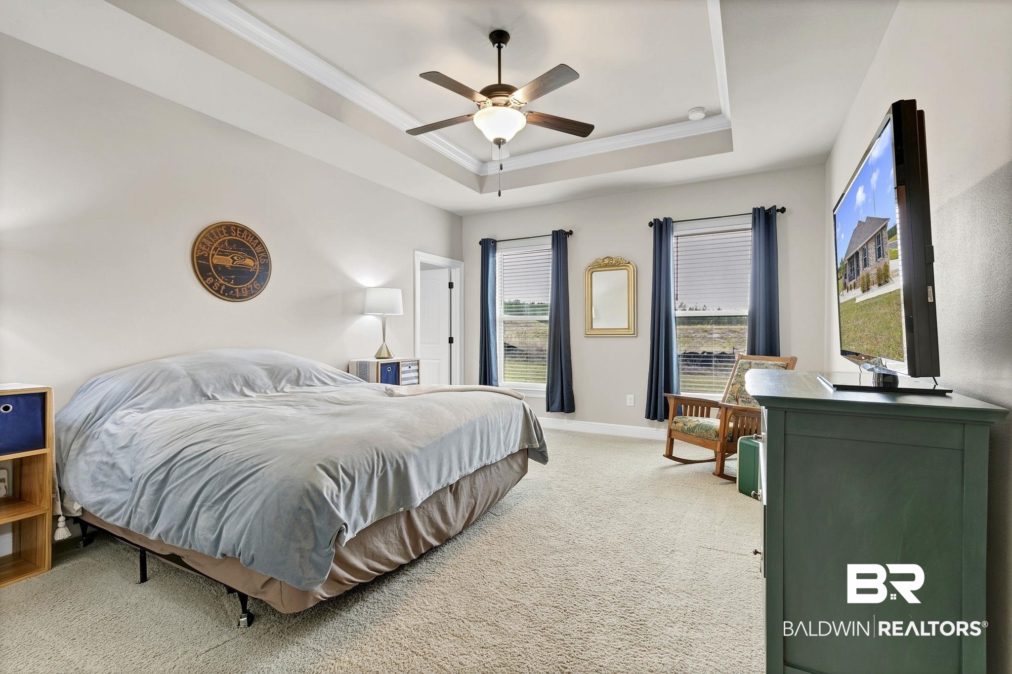 11247 Thistledown Loop Spanish Fort, AL 36527 - Photo 21 of 72 Bedroom featuring light colored carpet, a ceiling fan, baseboards, a tray ceiling, and crown molding