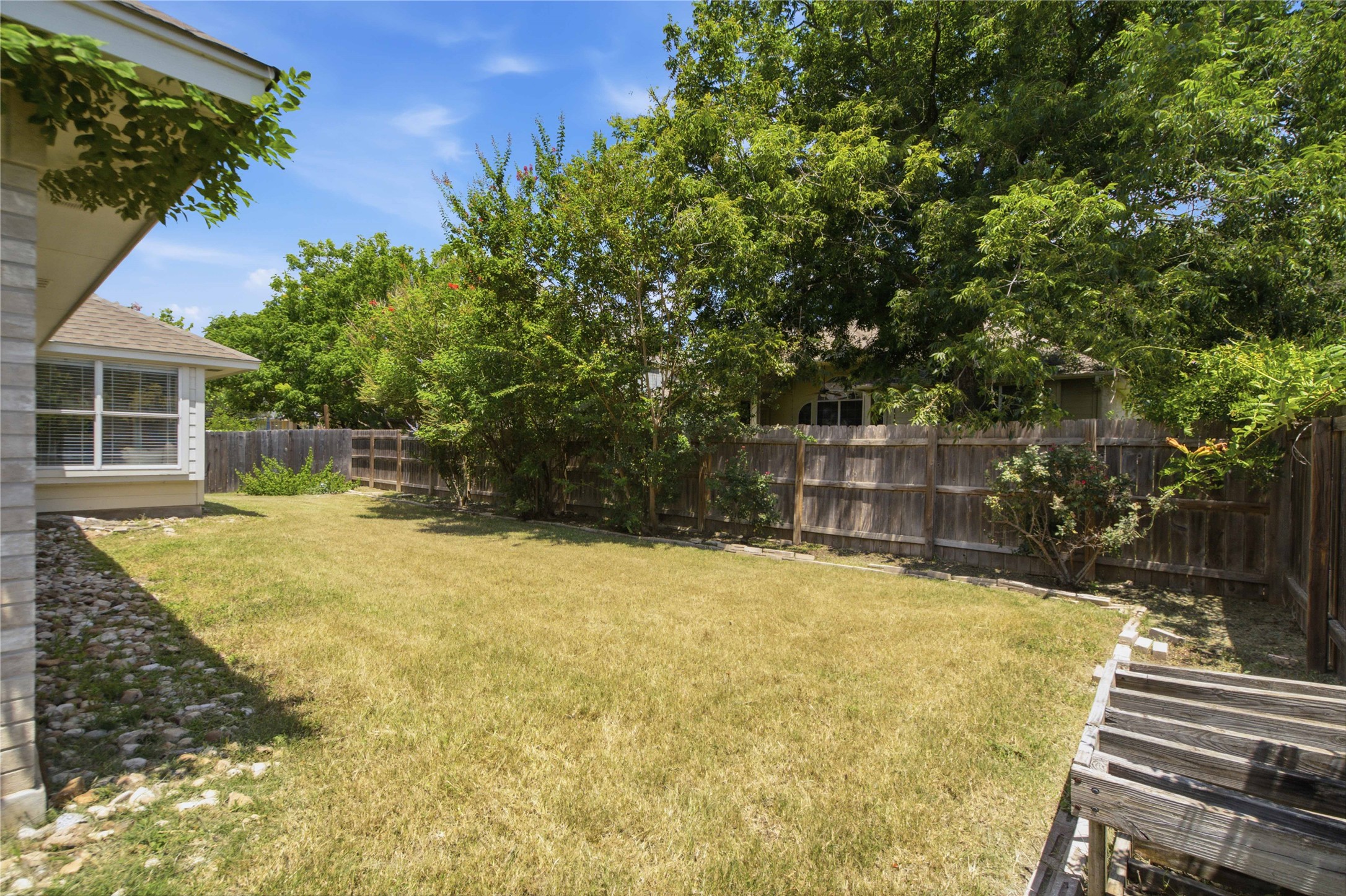 2920 Warwick Way Austin, TX 78748 - Photo 32 of 36 A well-maintained lawn offers ample space for outdoor enjoyment within a privacy-fenced yard