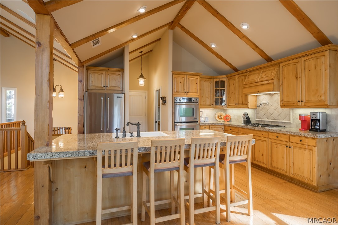 173 Grizzly Road Lake Arrowhead, CA 92352 - Photo 9 of 38 Kitchen island bar seating