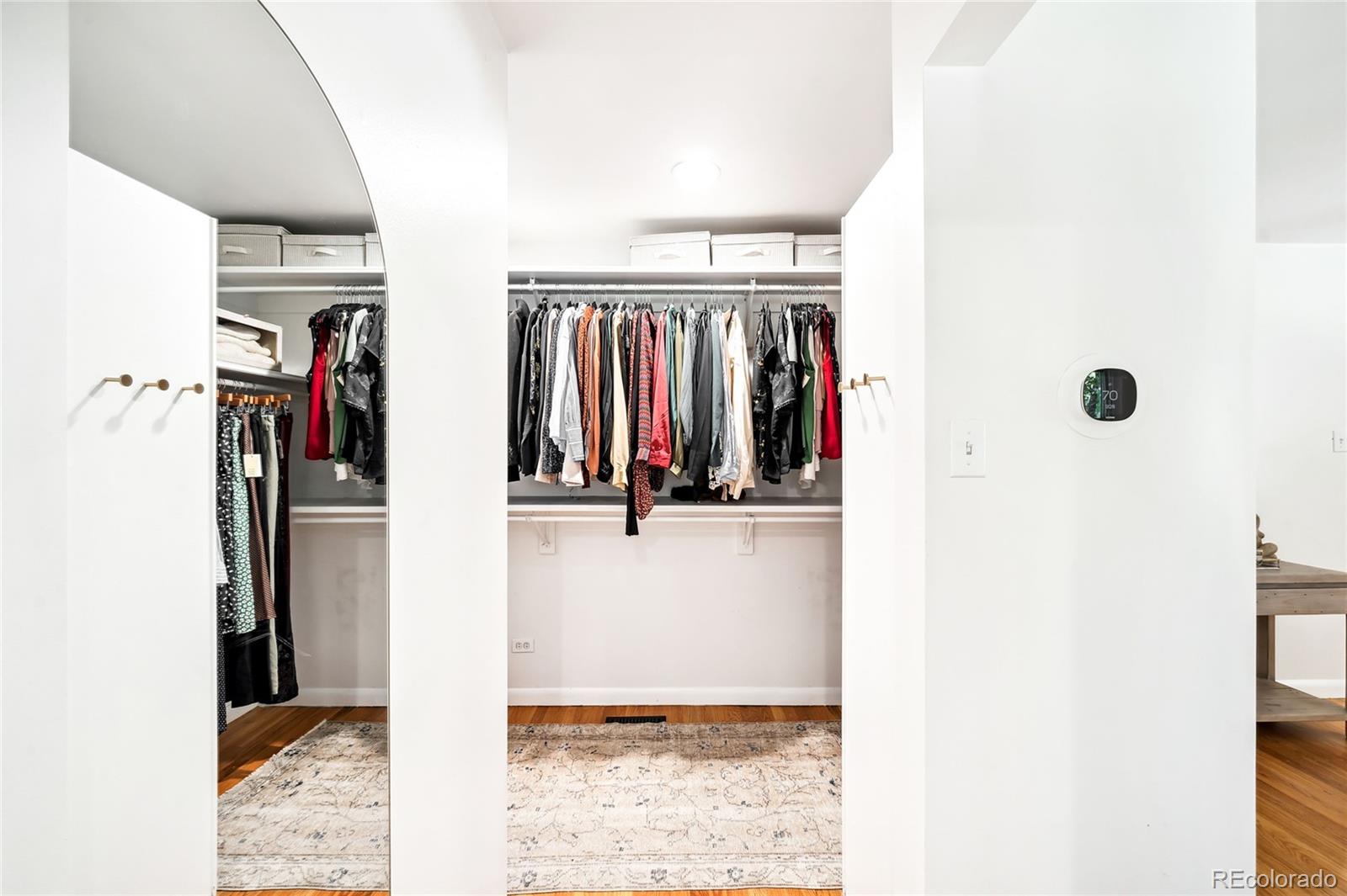 950 South Monroe Street Denver, CO 80209 - Photo 28 of 39 a view of walk in closet with clothes and shoes