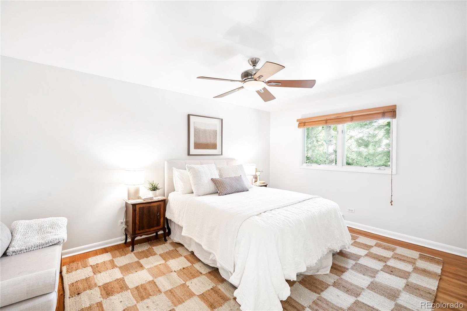 950 South Monroe Street Denver, CO 80209 - Photo 29 of 39 a bedroom with a bed and a window