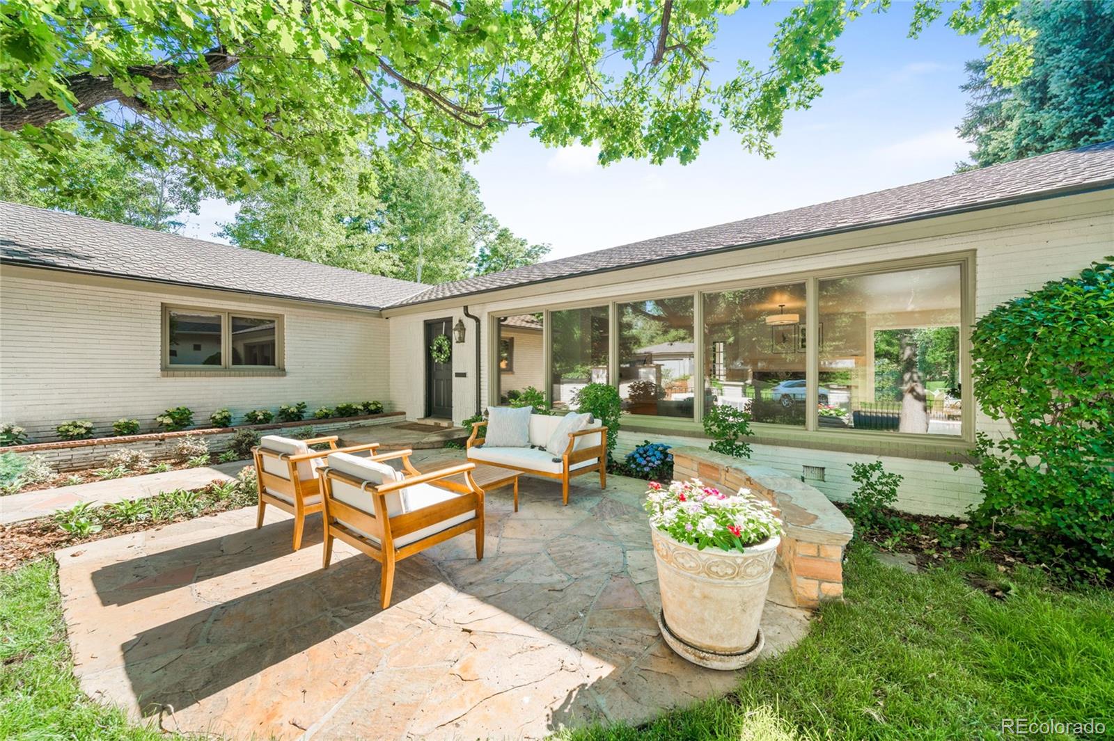 950 South Monroe Street Denver, CO 80209 - Photo 4 of 39 a view of a swimming pool and lounge chair