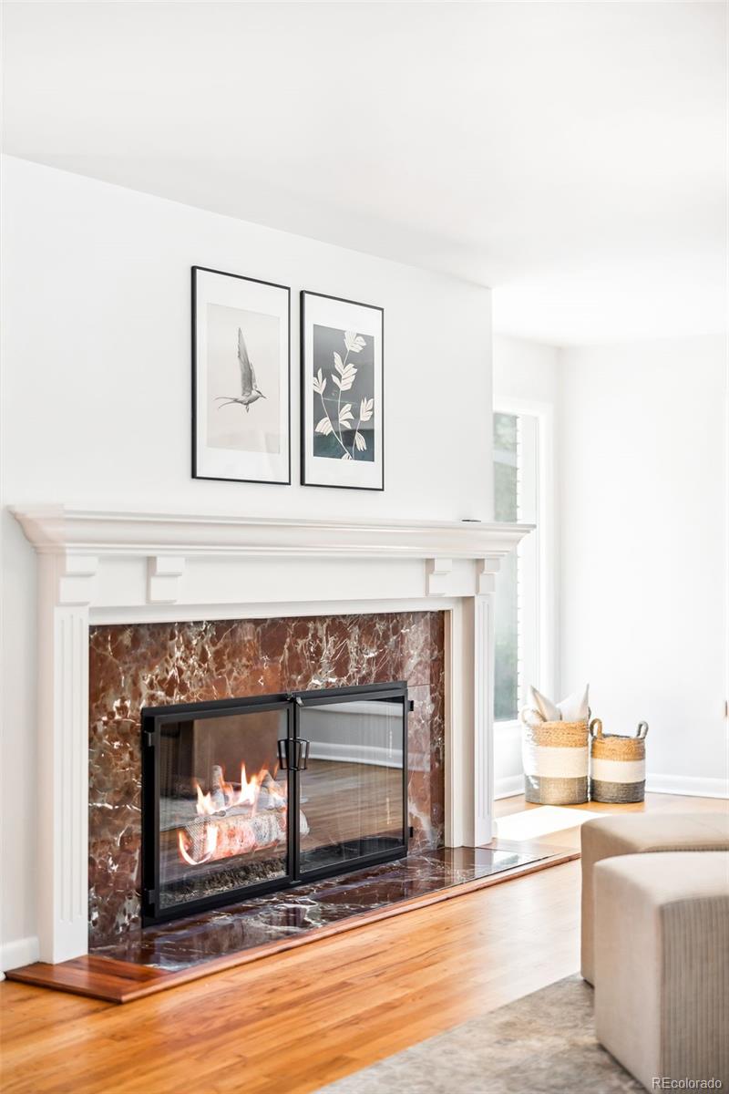 950 South Monroe Street Denver, CO 80209 - Photo 10 of 39 a living room with furniture and a fireplace