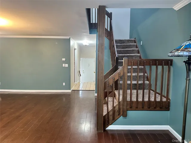 a bathroom with a granite countertop toilet sink and mirror