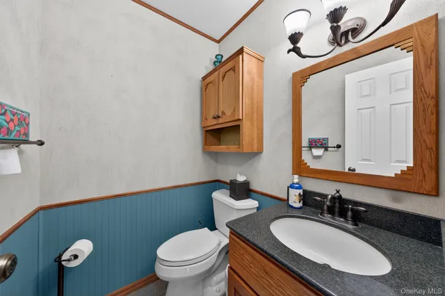 a bedroom with bed and a potted plant