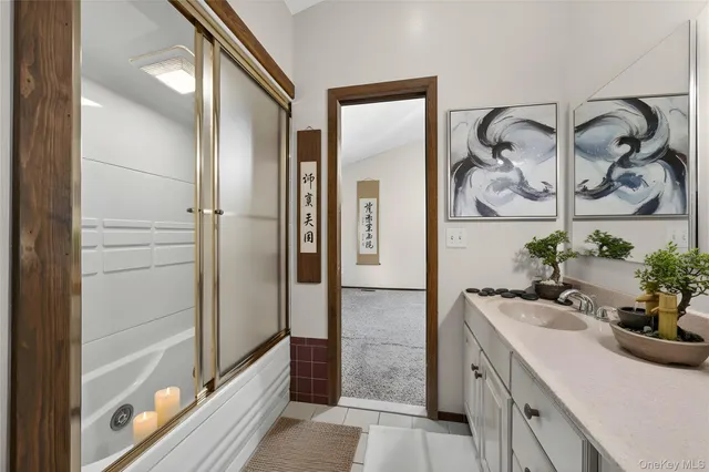 a bathroom with a double vanity sink and a mirror