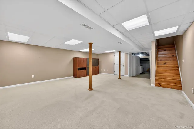 a living room with lots of furniture and a flat screen tv