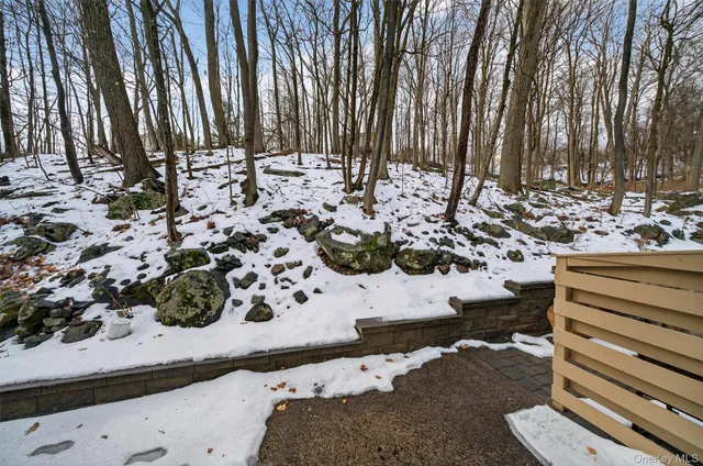 a view of a backyard with sitting area