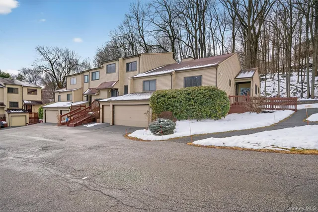 a view of city from balcony with seating space