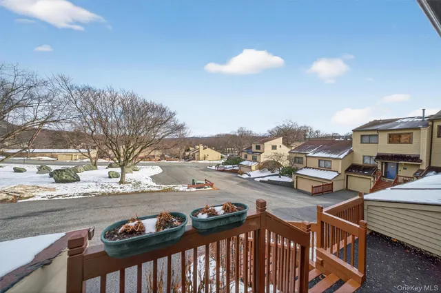a view of a backyard with sitting area