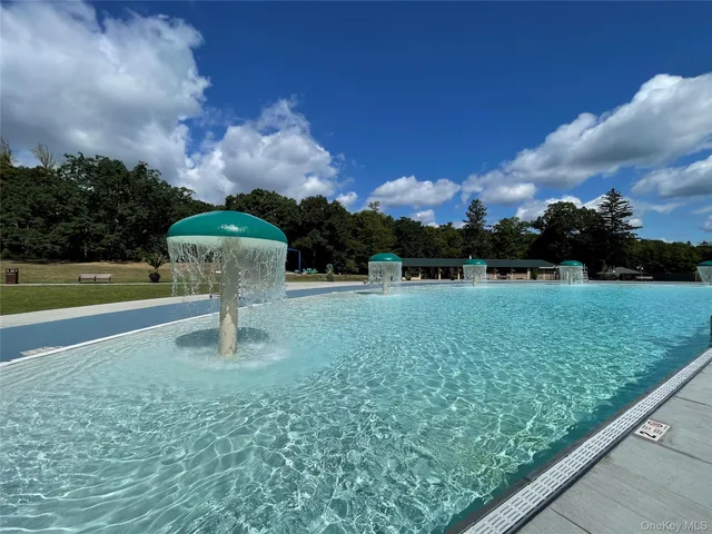 a view of backyard with trampoline