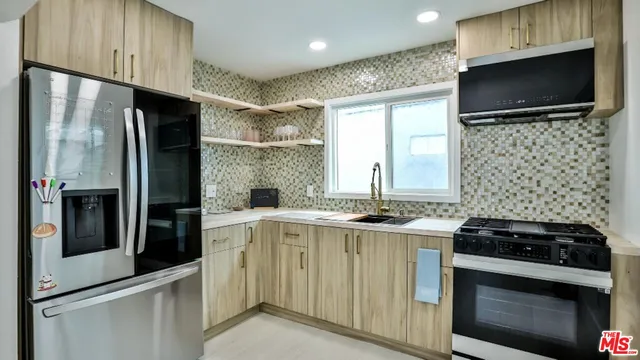 a kitchen with a stove and a microwave