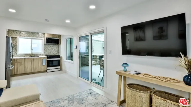 a living room with a flat screen tv and a fireplace