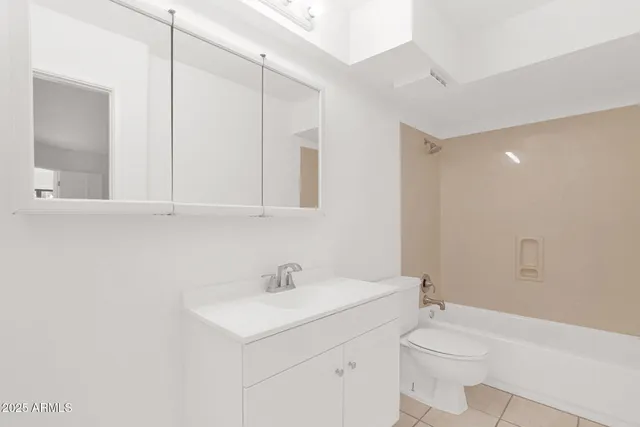 a bathroom with a sink toilet and vanity