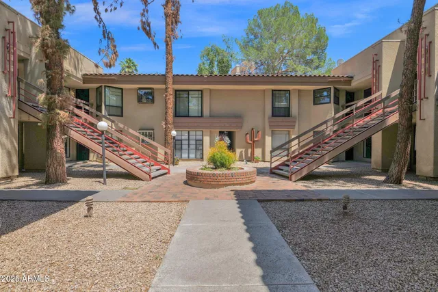 a view of a house with wooden stairs