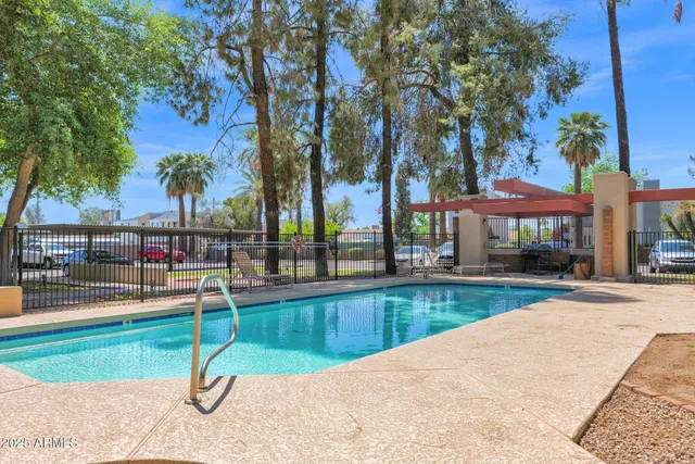 a view of a swimming pool with a patio